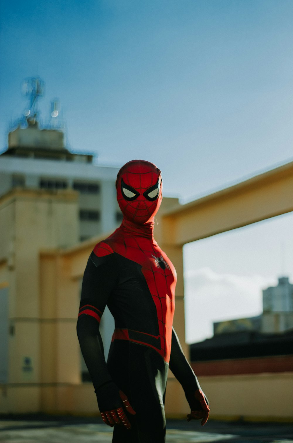 a man in a red and black spider suit