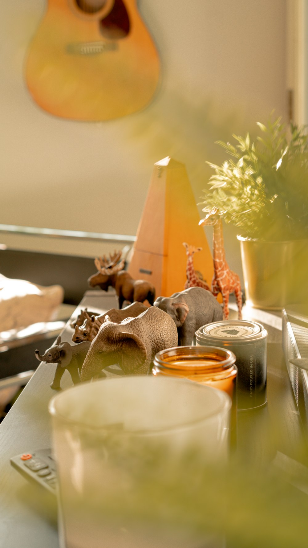 a close up of a table with a guitar in the background