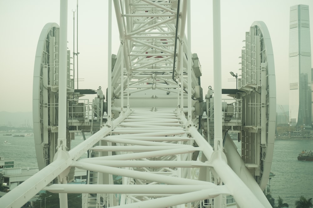 a very tall metal bridge over a large body of water