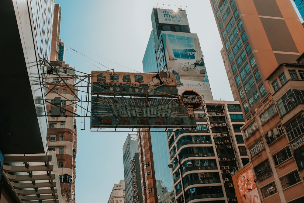 a sign that is hanging from the side of a building