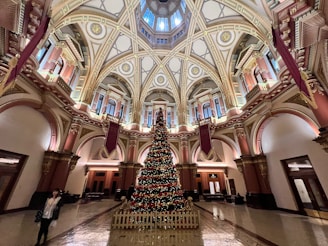 A themed event in a historic venue featuring intricate heritage details and festive decorations.