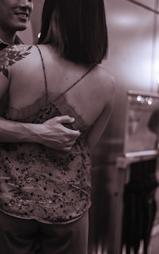 Photo of a colorful floral tattoo blending traditional and modern elements on shoulder