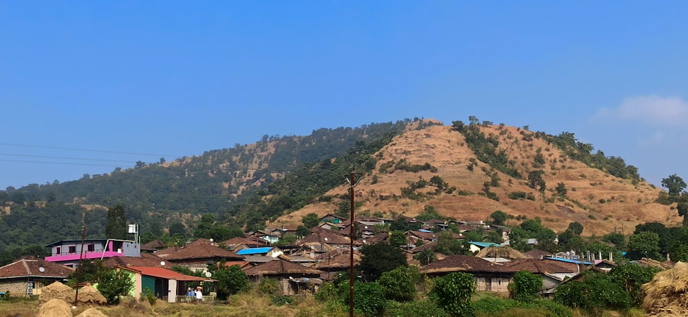 a small village in front of a mountain