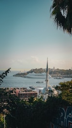 A scenic view of Makkah with a limousine in the foreground.