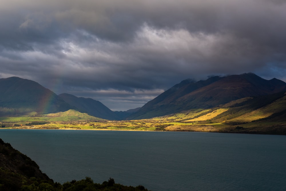 a large body of water surrounded by mountains