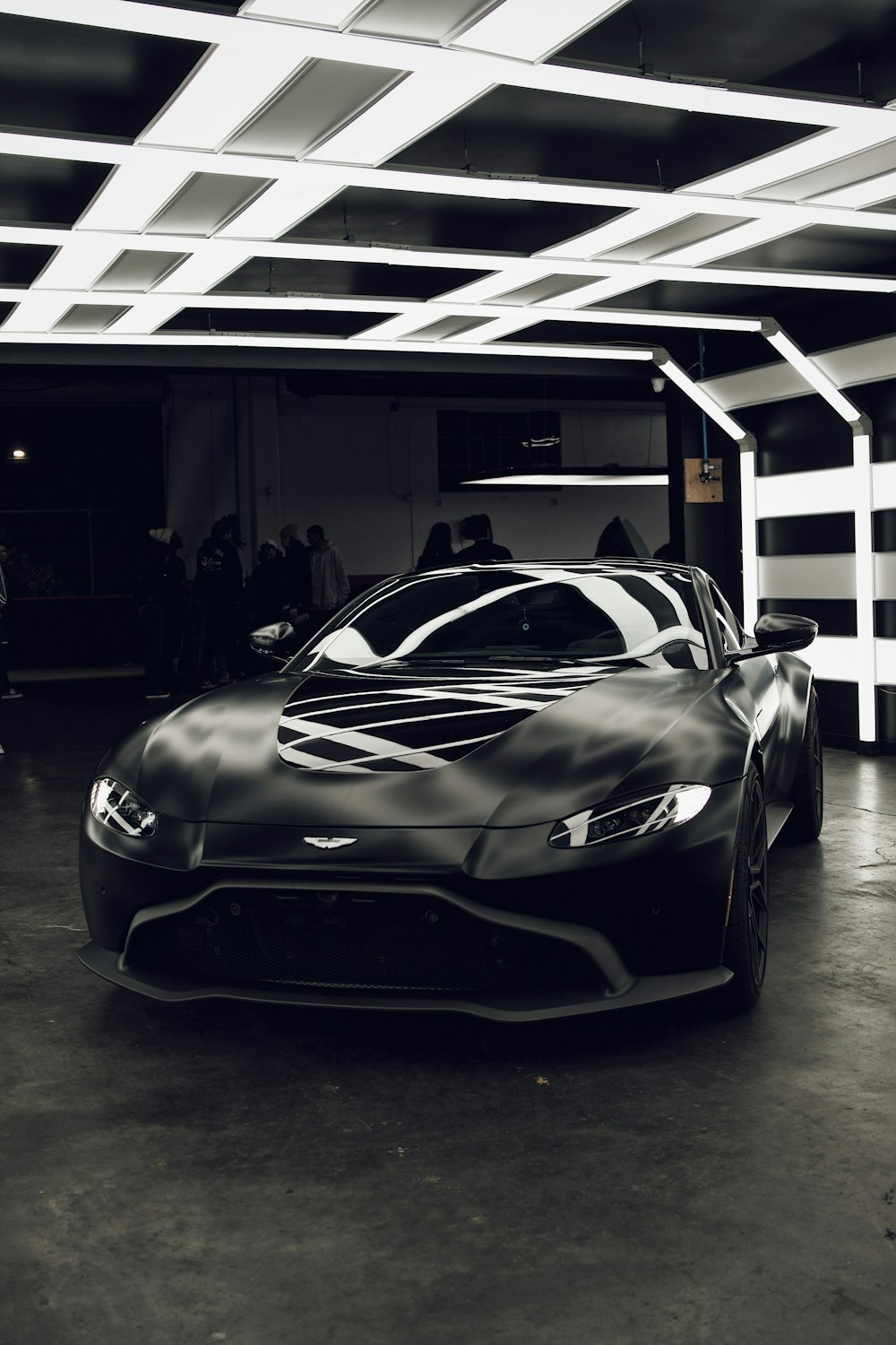 a black sports car parked in a garage