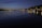 A charming night view of Lake Zurich with city lights reflecting on the water.