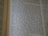 An open book displaying text with clear black font on a cream-colored page. The text is formatted in two columns, and the focus is on the central text, with parts slightly blurred on the edges.