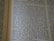 An open book displaying text with clear black font on a cream-colored page. The text is formatted in two columns, and the focus is on the central text, with parts slightly blurred on the edges.