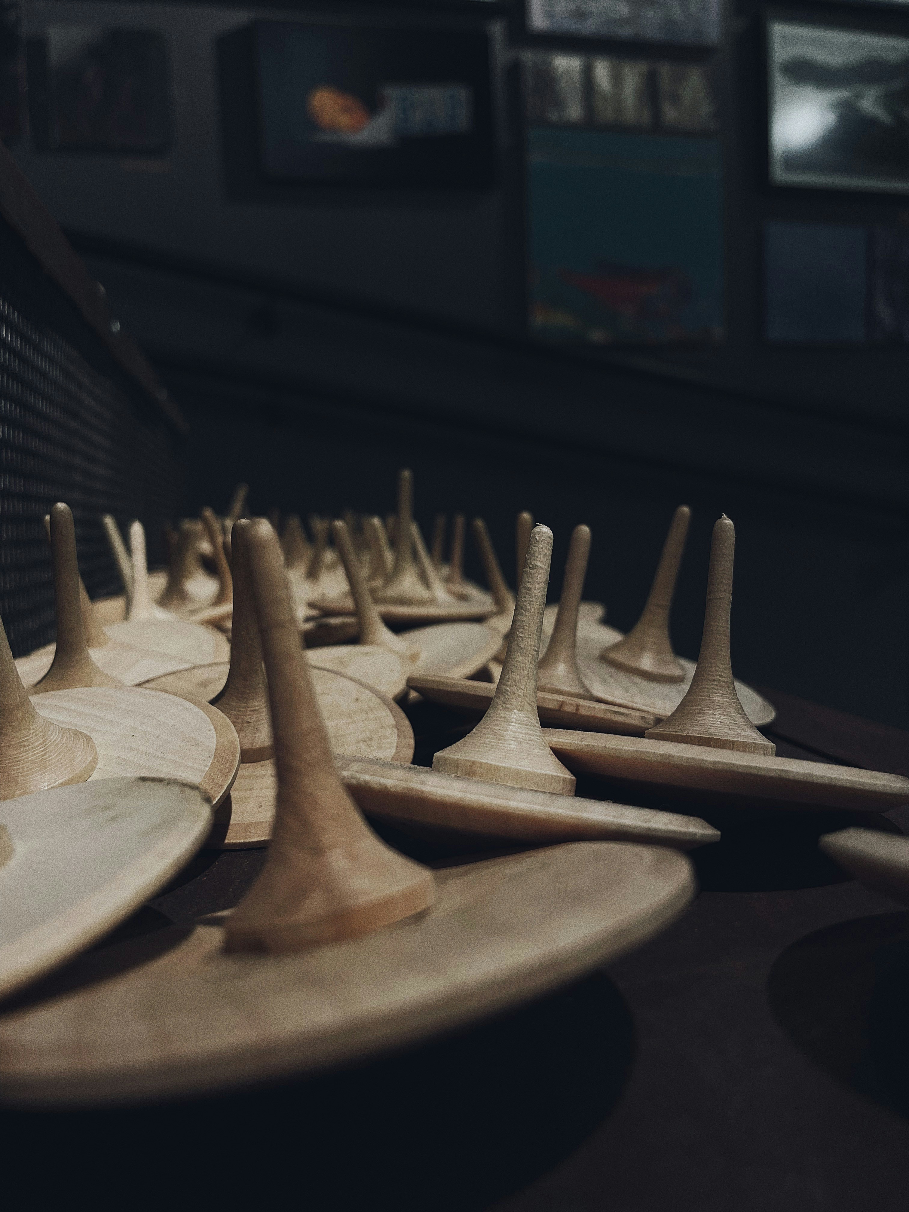 a row of wooden spoons sitting on top of a table