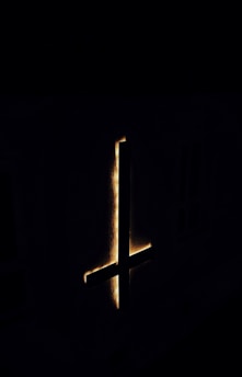 A dark, gothic-themed image representing the intersection of sacred and profane.