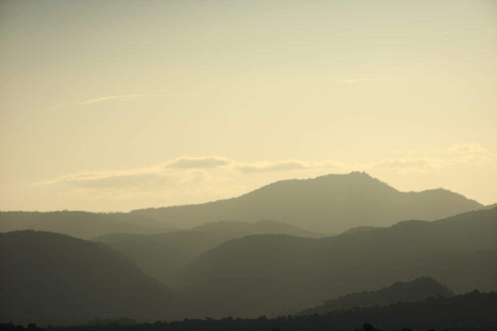 a view of a mountain range at sunset