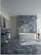 a bathroom with a marble wall and floor