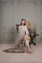 An elegant silk dupatta draped over a chair, showcasing its rich texture and vibrant colors.