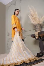 a woman in a yellow and white outfit