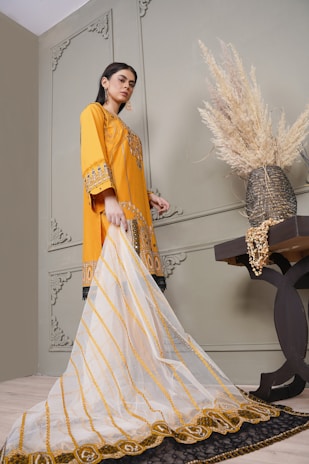 a woman in a yellow and white outfit