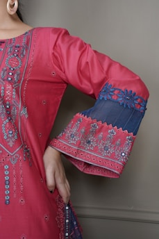 Close-up of delicate embroidery on a black abaya sleeve