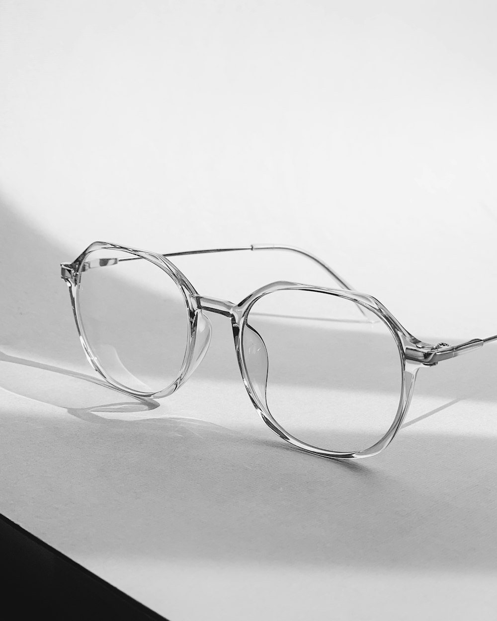 a pair of glasses sitting on top of a table