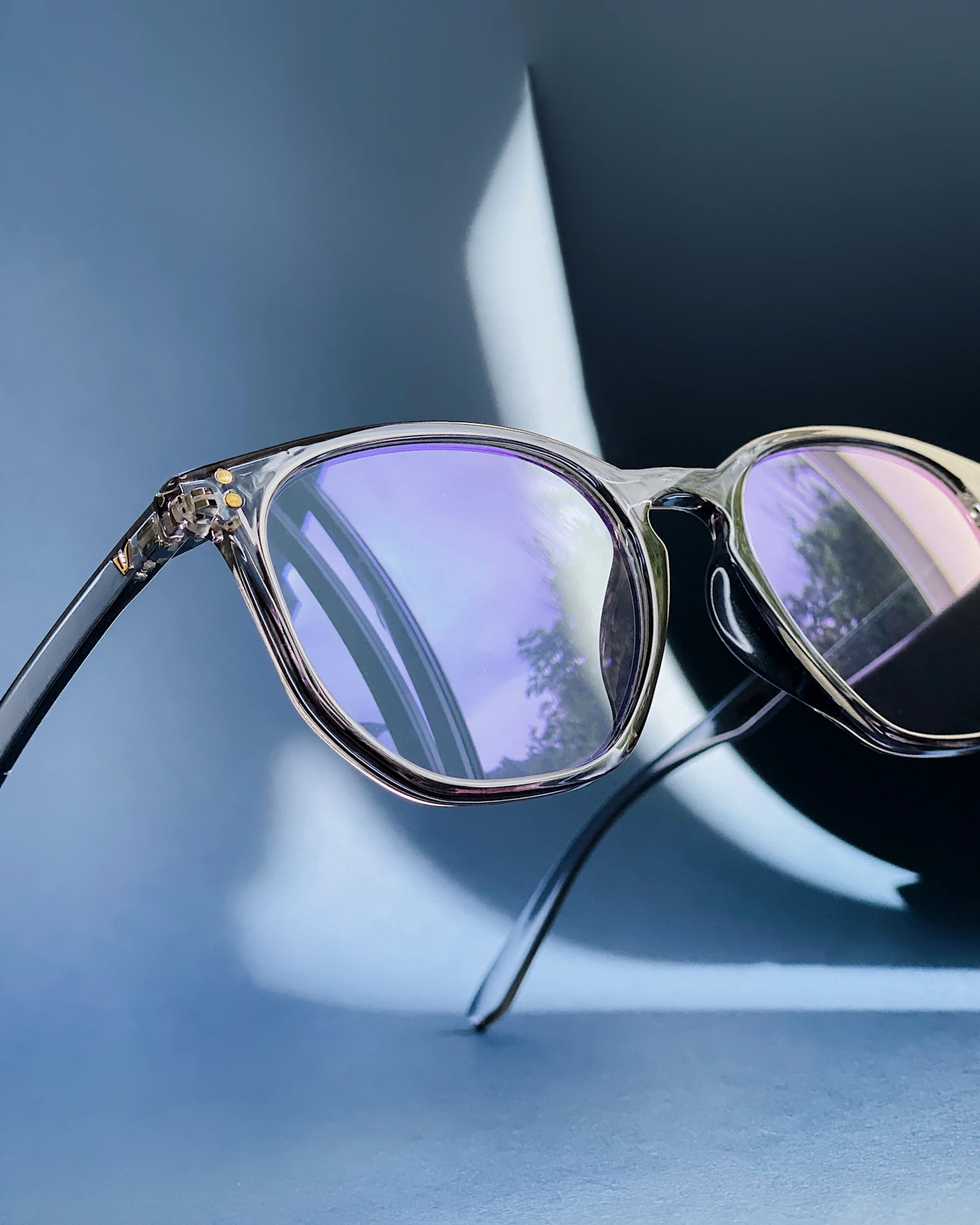 Sculptural sunglasses photographed on a tabletop