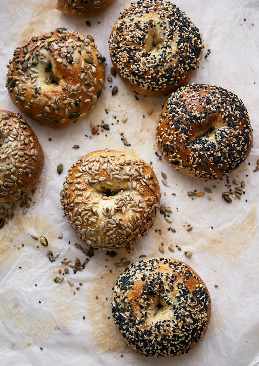 a bunch of bagels that are on a piece of paper