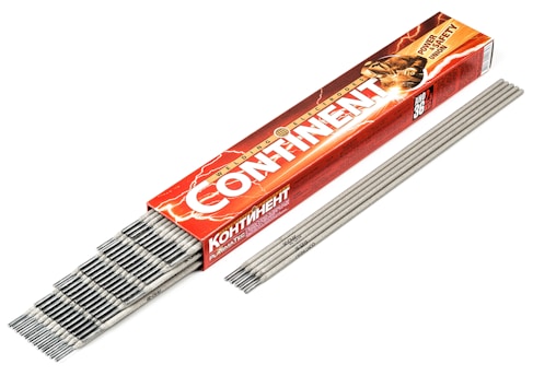 A red and orange box with the text 'CONTINENT' contains an array of gray welding electrodes. The box features a graphic of a person welding, with sparks visible. The electrodes are laid out neatly beside the box.