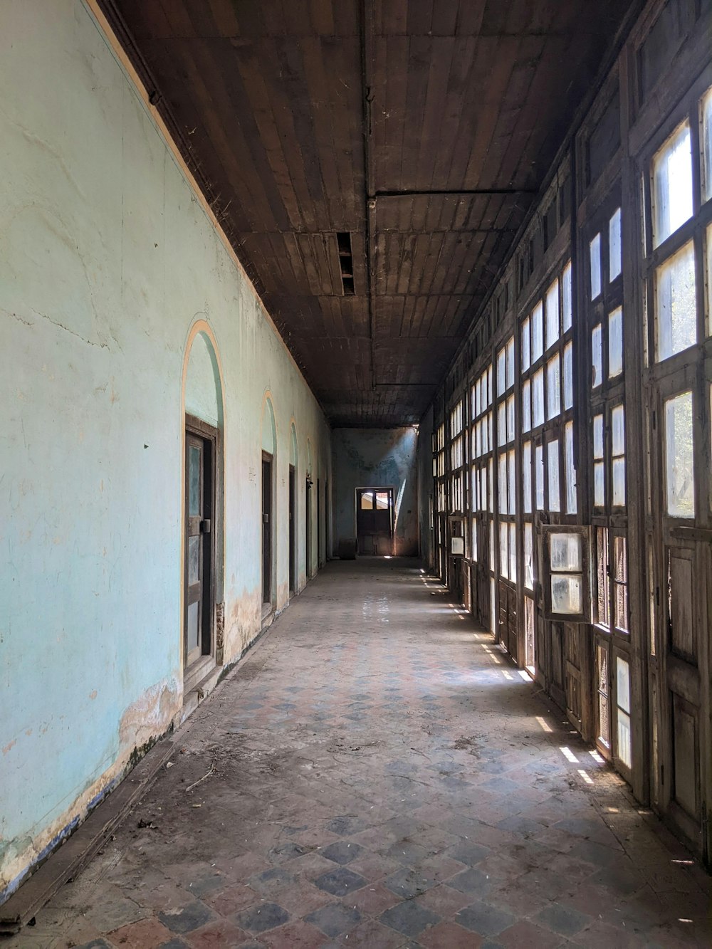 a long hallway with lots of windows in it