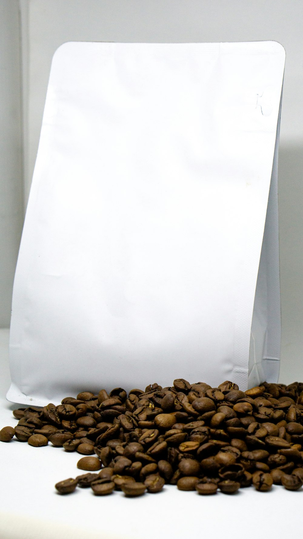 a bag of coffee beans sitting on top of a table