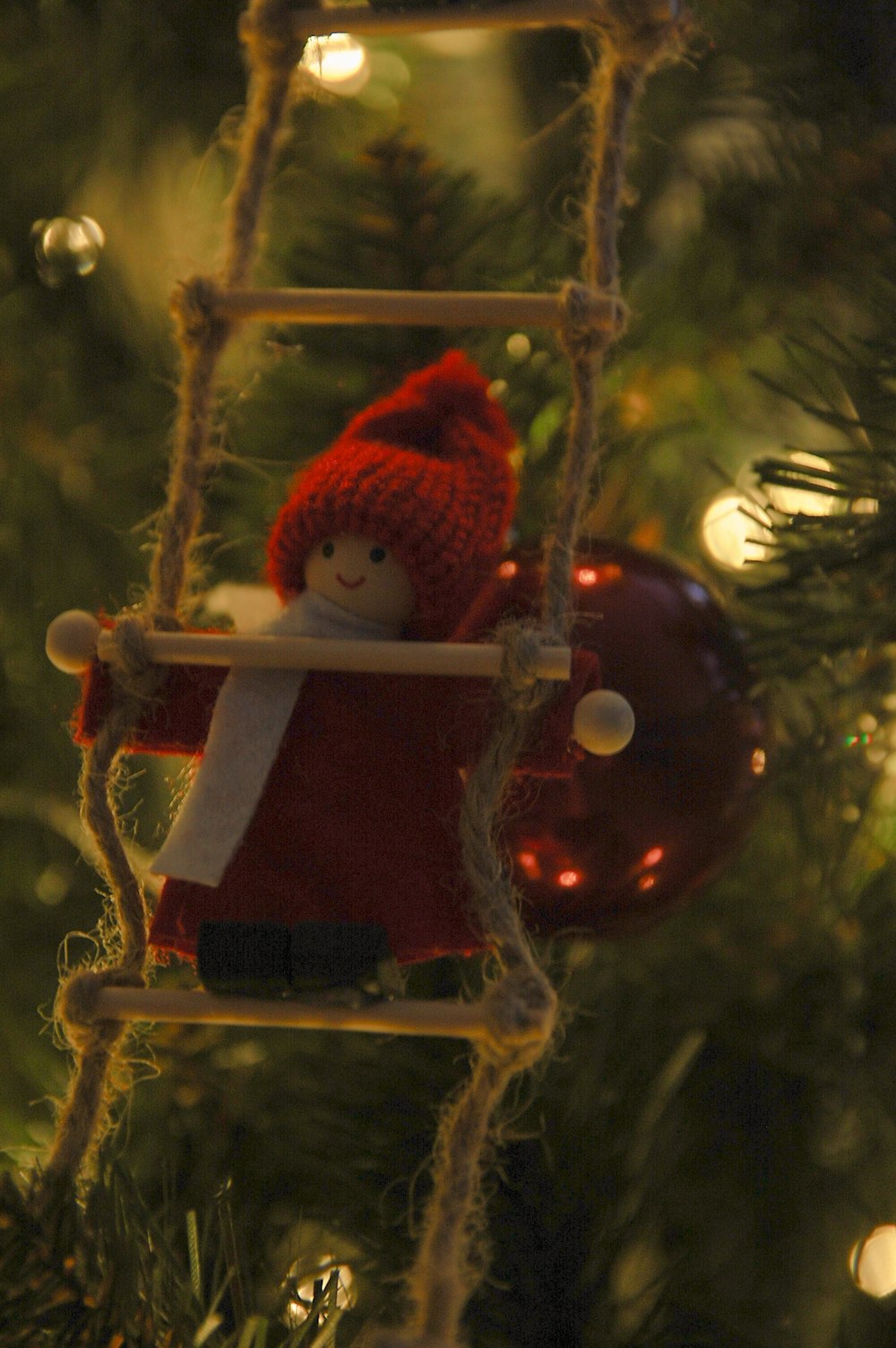 a christmas ornament hanging from a christmas tree