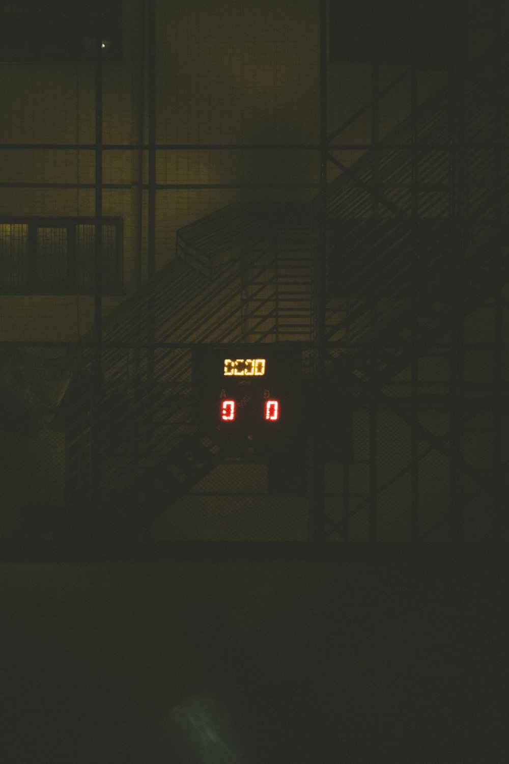 a clock that is on a building in the dark