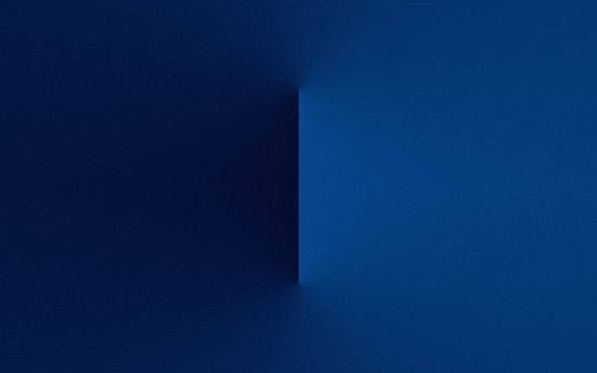 A serene dark blue and gold abstract bridge symbolizing connection and consciousness.