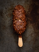 a scoop of ice cream with nuts on it