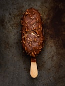 a scoop of ice cream with nuts on it