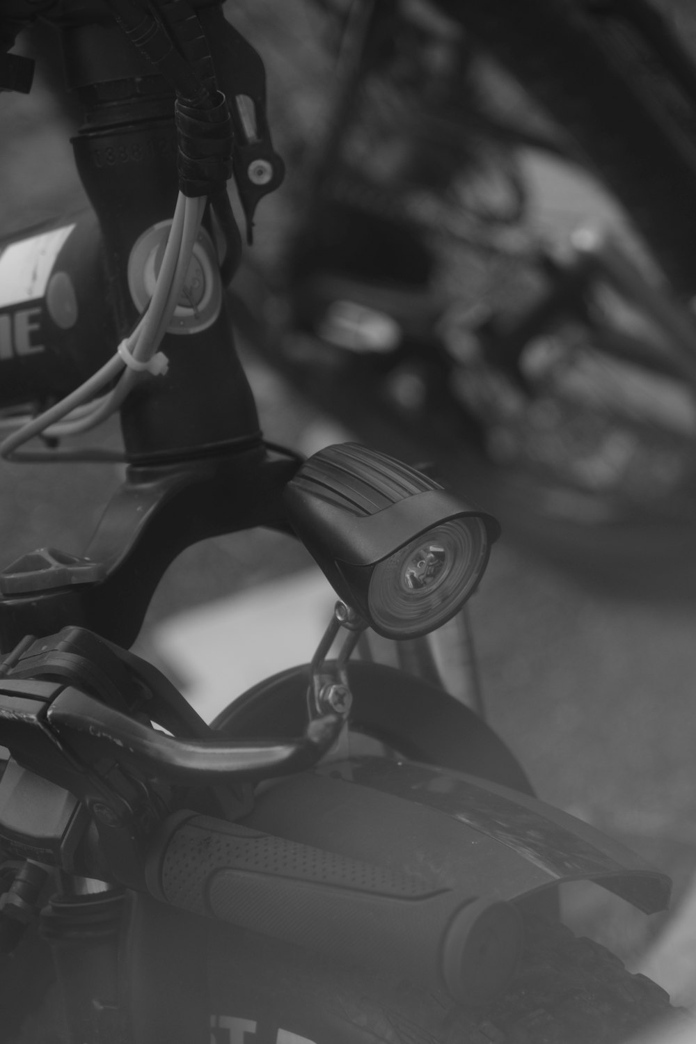 a black and white photo of a bike handle