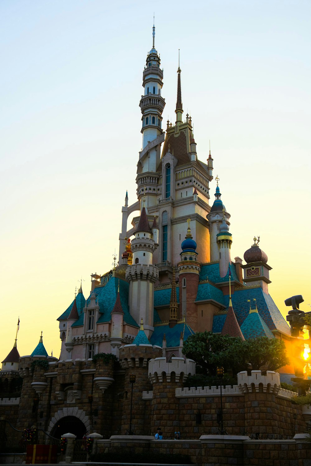 a very tall castle with a clock on it's side