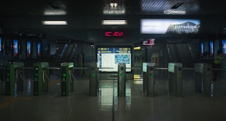 a train station with a lot of metal barriers