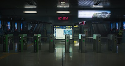 a train station with a lot of metal barriers
