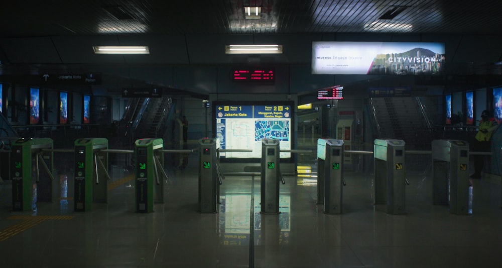 a train station with a lot of metal barriers