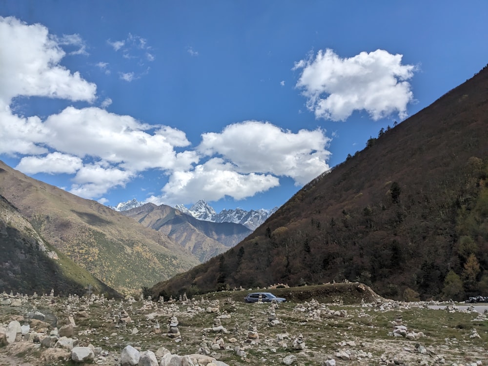 a car is parked in the middle of a valley