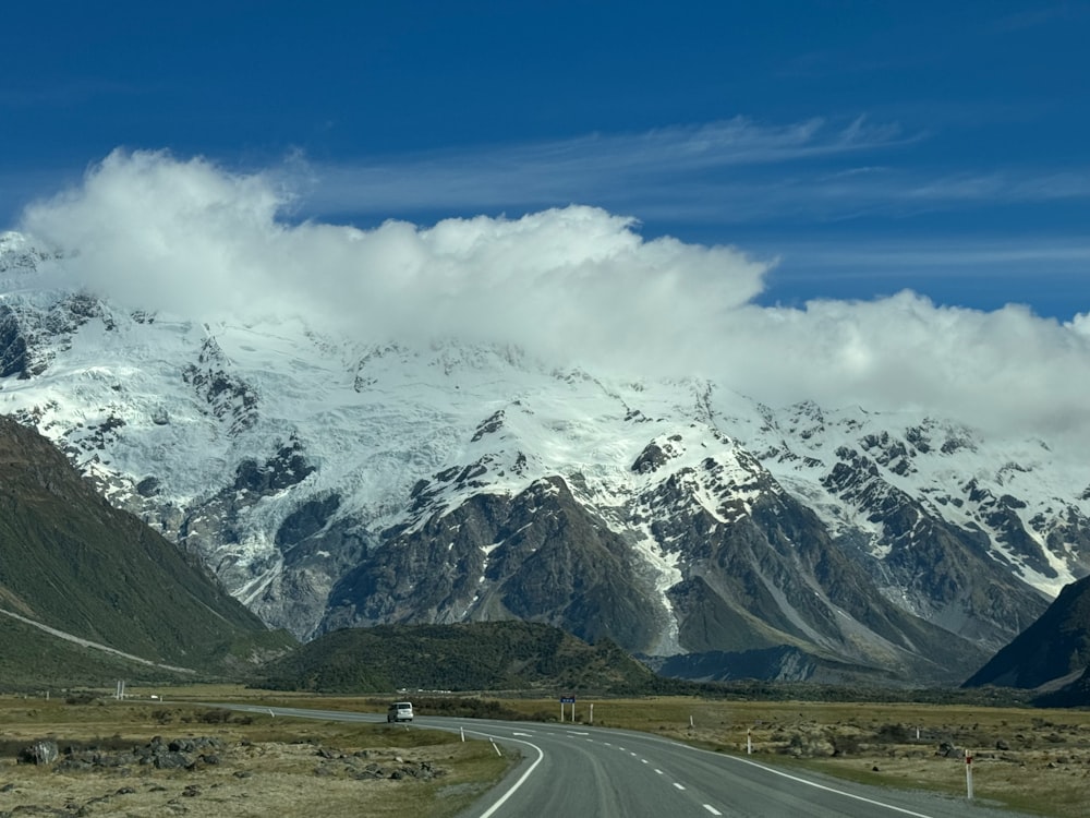 a long road with a mountain in the background