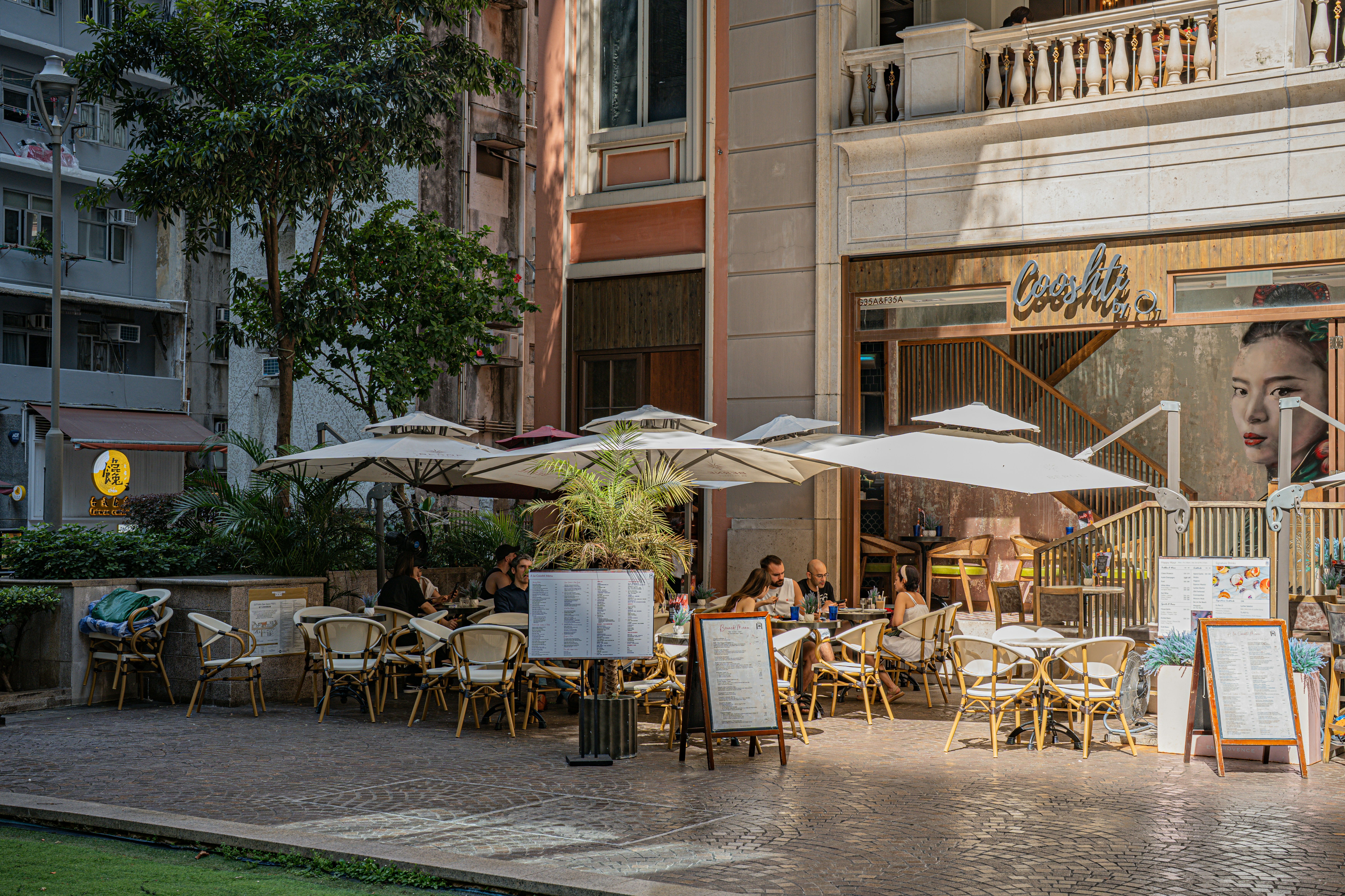 Outdoor patio dining area with ocean view at dusk