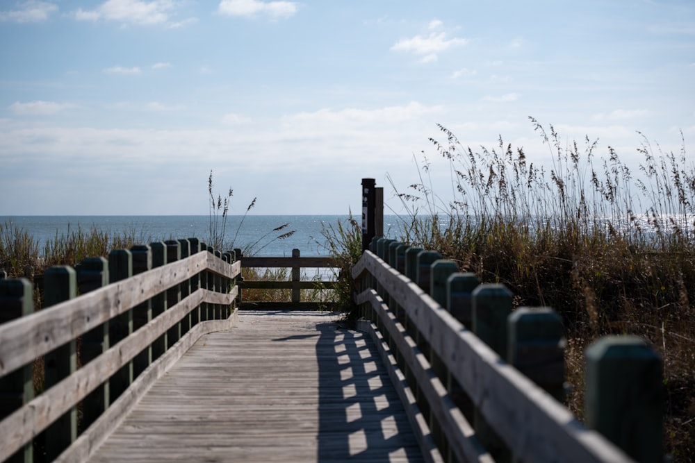 a wooden walkway leading to the beach