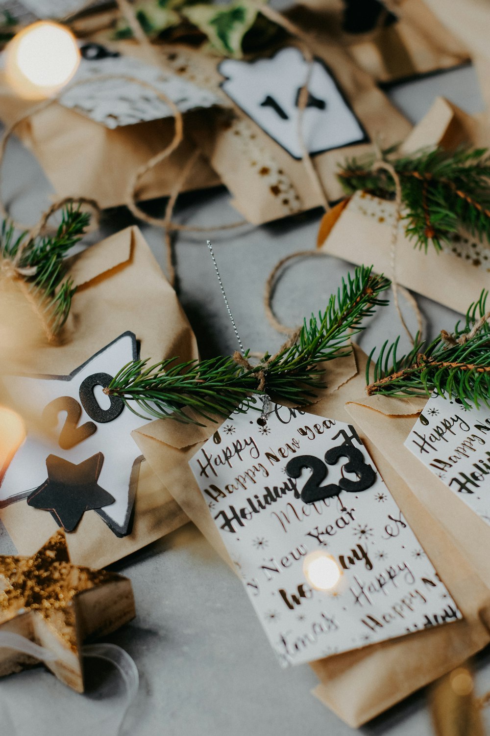 a table topped with brown paper bags filled with christmas decorations