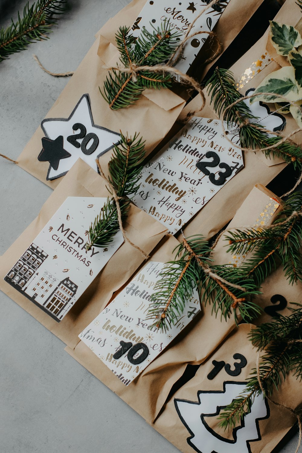 a bunch of brown paper bags with christmas decorations on them