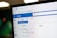 A close-up view of a computer screen displaying the Outlook email client. The image shows the Outlook interface with a tab labeled 'Email - Unsplash - Outlook' and the URL 'https://outlook.office.com'. The interface includes options like 'New email', 'Home', 'View', 'Help', and folder labels such as 'Inbox' and 'Drafts'. The cursor is pointing to the 'Inbox' which shows '0 items'.
