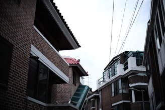 Street view showing modern urban electrical infrastructure with streetlights and power lines.