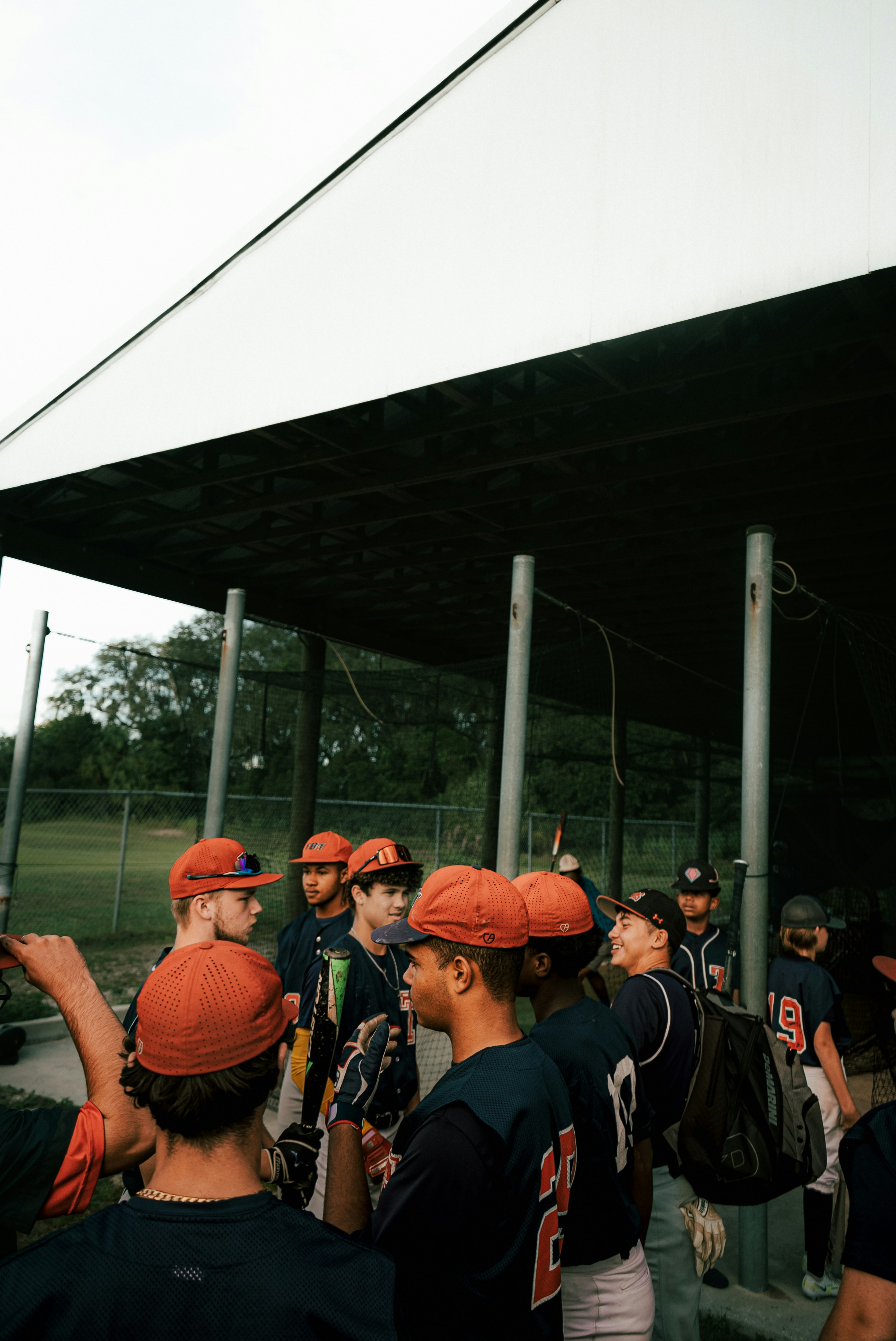 a group of baseball players standing next to each other