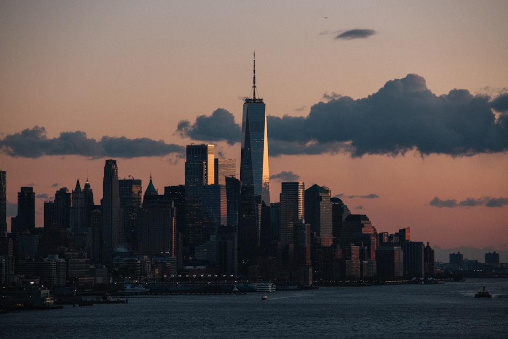 a view of a city skyline at sunset