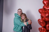 A couple holding keys and celebrating their first property purchase.