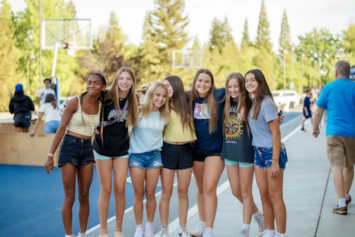 a group of young women standing next to each other