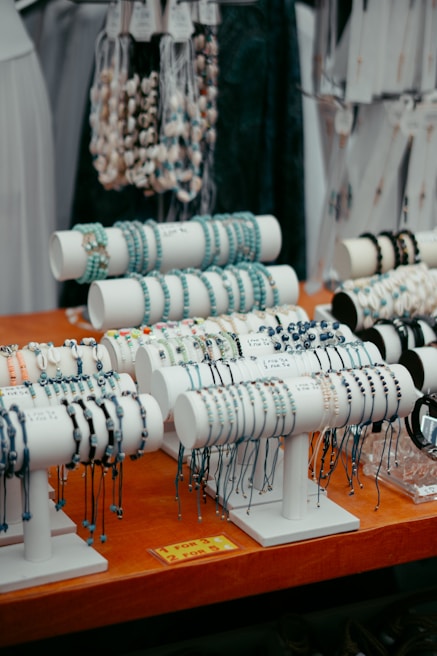 A close-up of colorful accessories displayed on a wooden table.